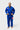 Student wearing the blue Gracie Barra Ripstop Lightweight Kimono with the red Barra Shield on the shoulder and the Gracie Barra lapel patch, front view.