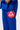 Close-up of the red Barra Shield patch on the thigh of the blue Gracie Barra Ripstop Lightweight Kimono pants with the drawcord waistband.