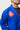Shoulder detail of the blue Gracie Barra Ripstop Lightweight Kimono showing the red Barra Shield patch and red contrast collar stitching on ripstop fabric.