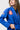 Angled view of the blue Ripstop Lightweight womens kimono jacket with red Barra Shield chest patch and Gracie Barra Jiu-Jitsu sleeve label