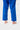 Lower legs of the blue Ripstop Lightweight womens kimono pants with the circular GB logo and red contrast hem stitching