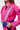 Chest detail of the pink Ripstop Lite Womens Kimono by adidas with the tonal Gracie Barra lapel patch, Barra Shield and purple adidas sleeve logo.