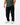 Ripstop Utility Pants in Black — front view on model from the waist down, showing the straight tapered leg worn with white sneakers.