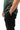 Ripstop Utility Pants in Black — side view on model showing the tonal Gracie Barra embroidery on the thigh and red-stitched pocket.