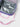 Close-up of the Sakura Kids Lunchbox's insulated silver interior and pink detachable shoulder strap hardware.