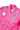 Close-up of Sakura V3 Kids pink BJJ Gi showing Red Shield chest logo, Gracie Barra lapel detail, and Sakura embroidery on shoulder.