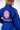 Close-up rear view of the Sakura V3 Women’s Kimono in blue highlighting large Red Shield back logo, Equipe detail, and pink Sakura embroidery on shoulder