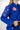 Close-up of Sakura V3 Women’s Kimono in blue featuring pink Sakura sleeve embroidery, Red Shield chest logo, and pearl weave fabric detail