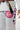 Close-up of Sakura V3 Women’s Kimono white pants featuring large Red Shield logo and purple Sakura embroidery along the leg