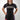 Female model wearing Sakura V3 Women’s black BJJ rashguard with purple stitching and Gracie Barra logo, front view, studio background