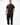 Stacked Button Up in Black — full front view on model styled with black pants and white sneakers, showing the relaxed everyday fit.