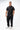Stacked Button Up in Black — full front view on model styled with black pants and white sneakers, showing the relaxed everyday fit.