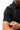 Stacked Button Up in Black — collar and sleeve close-up showing the point collar and short-sleeve cuff on the black button-up.