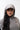 Stacked Womens Cap, slate — worn front-facing with a grey hoodie, showing the white embroidered stacked Gracie Barra wordmark on the front panel.