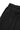 Close-up of black women’s mid-rise wide leg fleece pants showing the elastic waistband and subtle tonal embroidery detail, photographed on a light background.