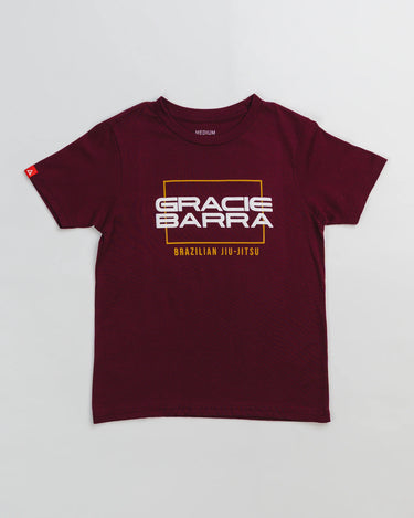 Maroon youth t-shirt with raised puff print "Gracie Barra" in white and "Brazilian Jiu-Jitsu" in yellow, displayed flat on a white background.
