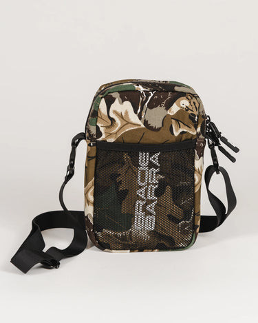 Camouflage crossbody bag with black mesh front pocket and vertical Gracie Barra stacked logo.