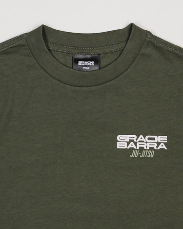 Close-up of chest area with white Gracie Barra Jiu-Jitsu logo on green Tactical Kids Tee.