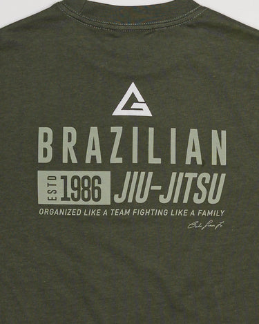 Close-up of back print on green Tactical Kids Tee with Legacy G logo and “Brazilian Jiu-Jitsu” text.