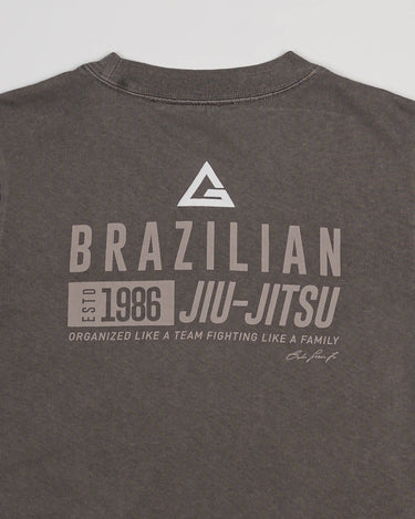 Close-up of back print on Tactical Women’s Tee in gray featuring Legacy G logo and “Brazilian Jiu-Jitsu” text, displayed on a light gray background.