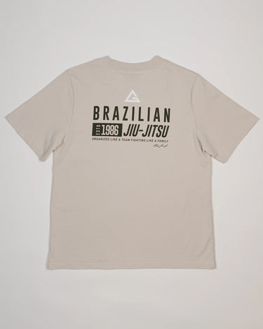 Back view of beige Tactical Women’s Tee with bold “Brazilian Jiu-Jitsu” text and graphic print design.
