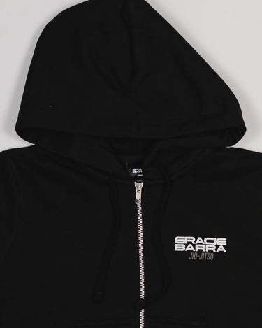 Close-up of chest area with white Gracie Barra Jiu-Jitsu logo on black Tactical Women’s Zip Hoodie.