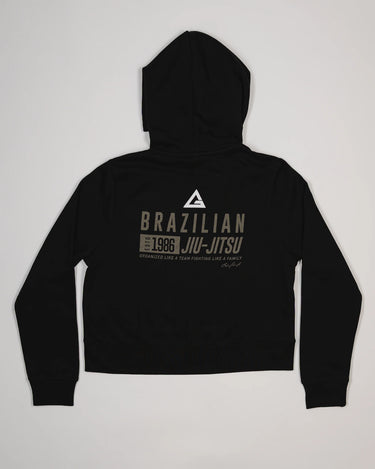 Back view of black Tactical Women’s Zip Hoodie with “Brazilian Jiu-Jitsu” text and Legacy G Logo.