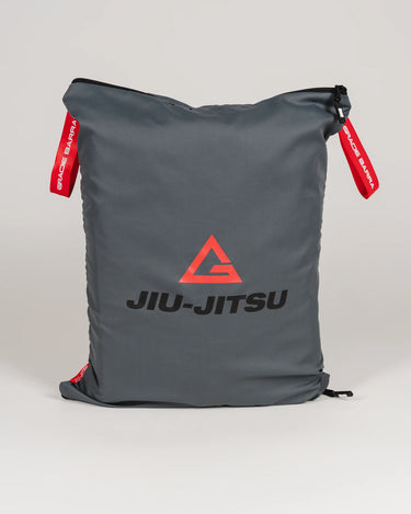 Grey GB Tech Wash Bag made from PU-coated ripstop with red Gracie Barra drawcords and Legacy G Jiu-Jitsu logo on the front.