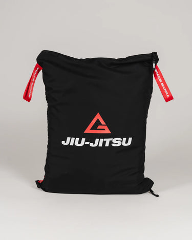 GB Tech Wash Bag in black with red drawstrings, featuring the Legacy G and Jiu-Jitsu logo, made from durable PU-coated ripstop for odor containment.
