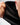 Technical Flow Mens Hoodie in black, macro close-up of hand holding the hood to show its smooth sweat-wicking lining fabric.