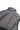 Close-up of the Technical Flow men’s black puffer vest showing the insulated back collar, reinforced shoulder seams, and smooth upper panel construction for structured comfort.