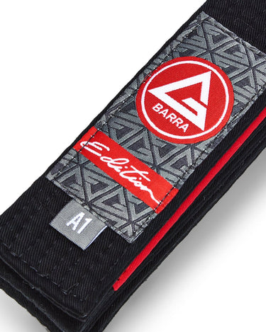 Close-up of the Black Belt’s Red Shield label, Edition patch, reinforced stitching, and red rank-stripe sleeve