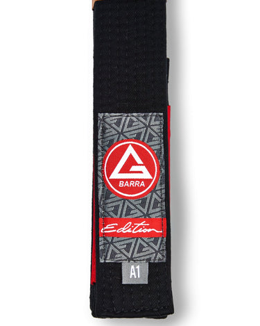 Vertical view of the black GB Edition Adult Belt highlighting the Red Shield label, Edition patch, and size tag.