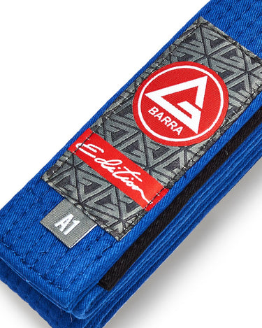 Close-up of the Blue GB Edition Adult Belt showing the Red Shield patch, Edition label, reinforced stitching, and size tag.