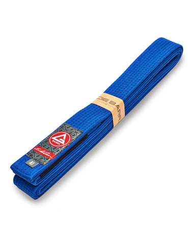Folded blue GB Edition Adult Belt displayed diagonally with Red Shield patch, rank stripe sleeve, and size label.