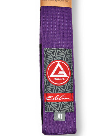 Vertical view of the Purple GB Edition Adult Belt highlighting the Red Shield patch, Edition label, and size tag.