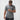 Video of a male model turning to show the front, back, and side of the Flow Men's Tech Tee in dark grey and Frame Men's Short in black