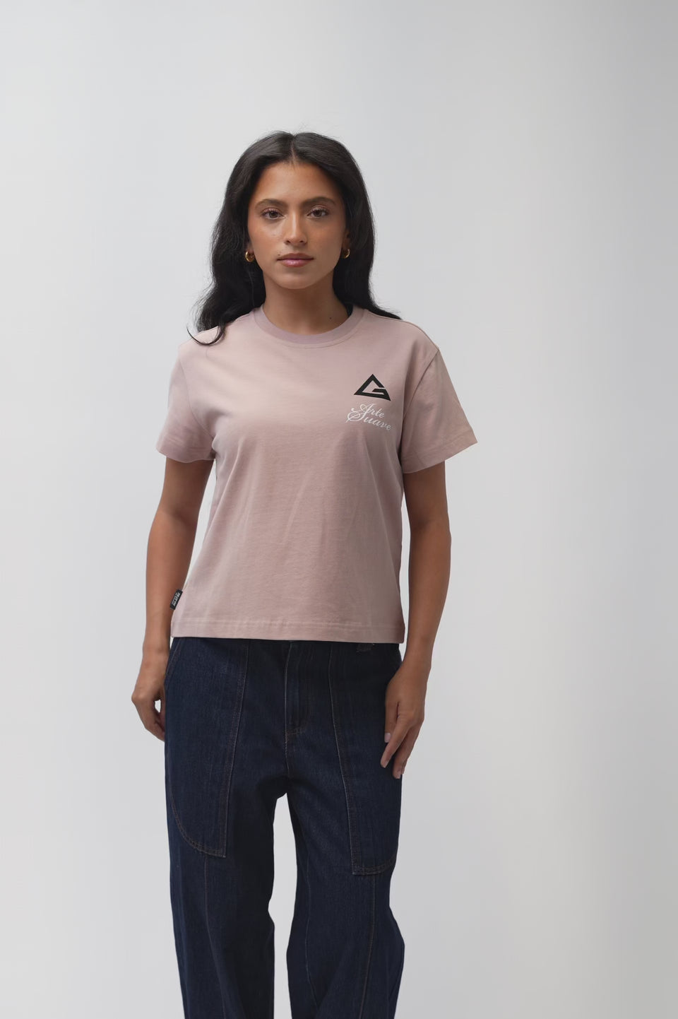 Arte Suave V3 Womens Tee in mauve, worn by a model turning to show the front chest print and the full Arte Suave back graphic with the Gracie Barra wordmark.