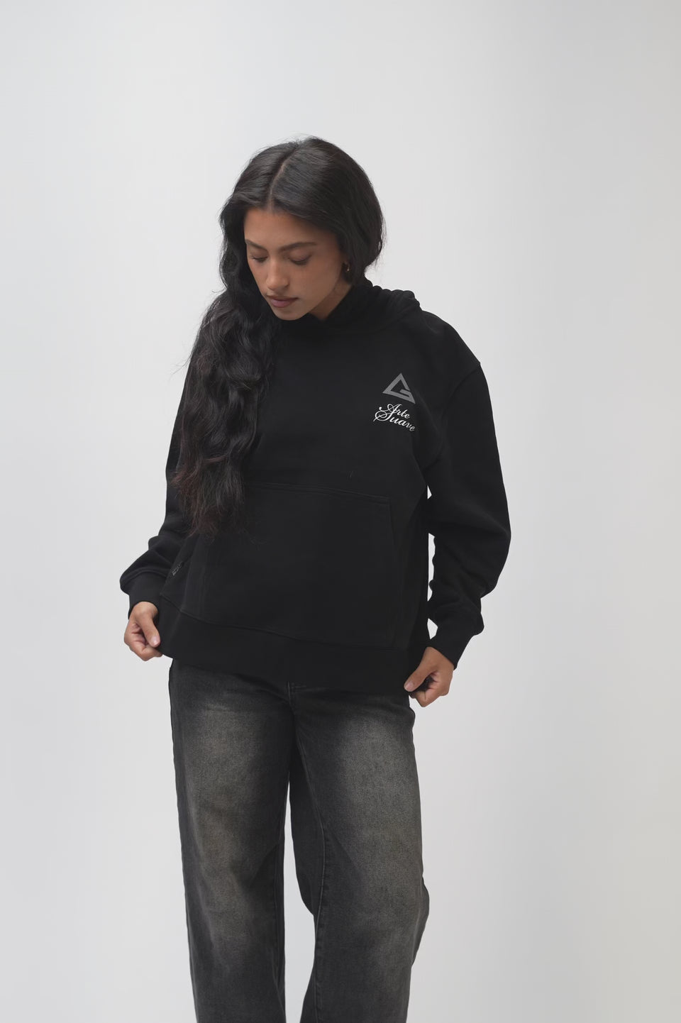Video of the Arte Suave V3 Womens Hoodie in black: model turns to show the silver Legacy G chest print and the full-back 'Arte Suave' / 'Gracie Barra' graphic.