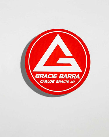 Red GB Shield round sticker on white background, front view.